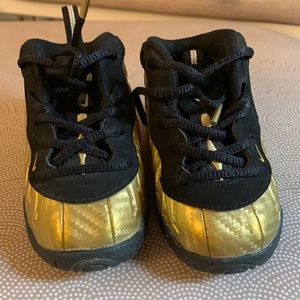 Infant gold and black foamposites size 5c.